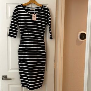 3/4 sleeve round neck casual dress. Has pockets!